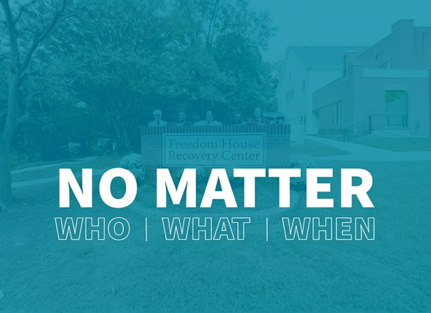 Sign reading 'Freedom House Recovery Center' with text 'NO MATTER WHO | WHAT | WHEN'