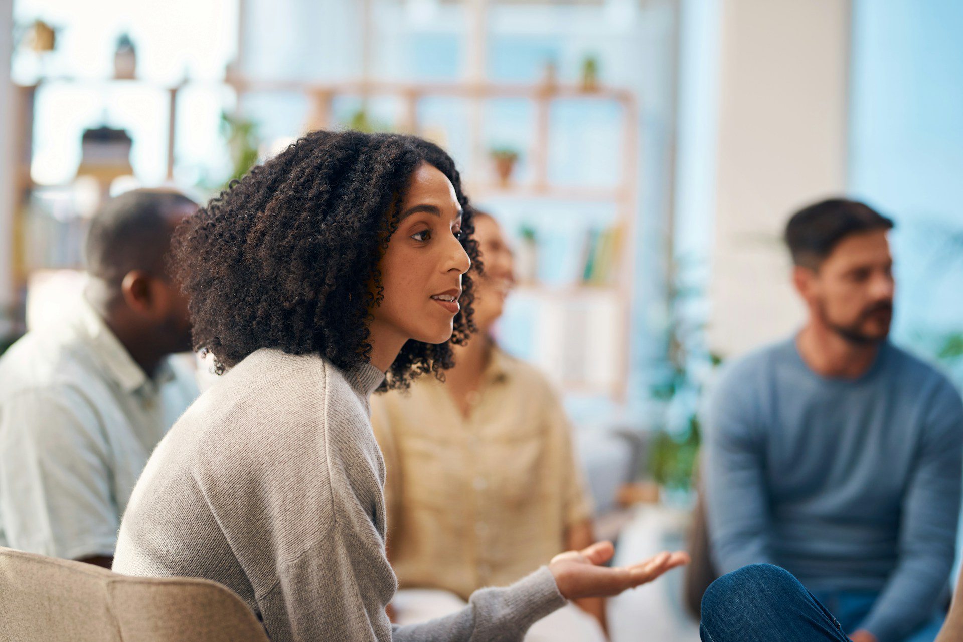 Woman speaking in a group therapy or counseling session