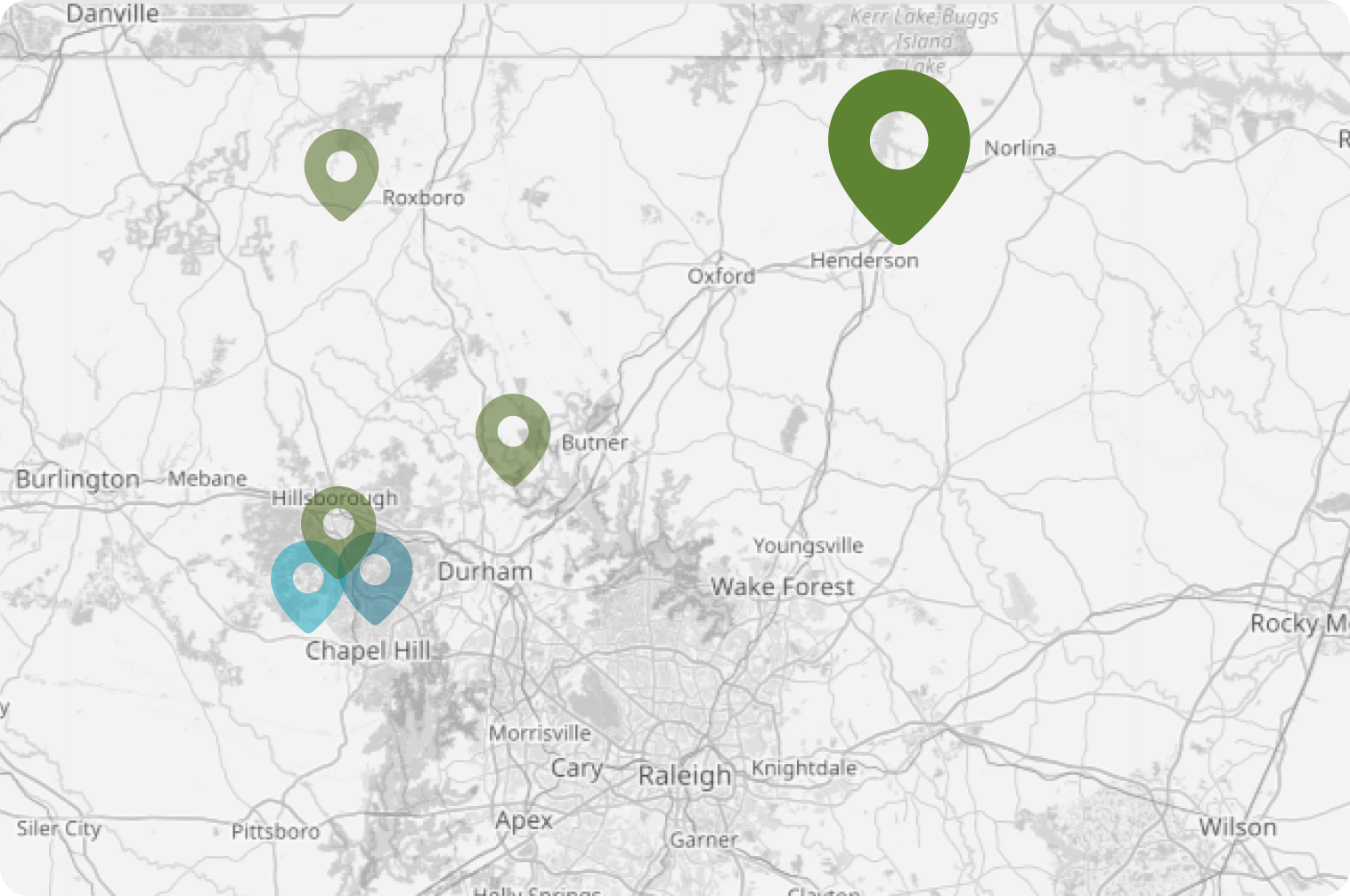 Map showing clinic locations marked by green and blue pins near Durham and Chapel Hill